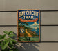 A vintage metal sign for the Bay Circuit Trail in Massachusetts, featuring a scenic illustration of a coastal landscape with a sailboat.