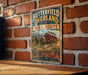 A vintage-style metal sign for the "Butterfield Overland Mail Route" in California, featuring a red horse-drawn carriage and mountains in the background.