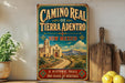 A vintage-style metal sign for the Camino Real de Tierra Adentro trail in New Mexico, featuring a desert landscape with a church and mountains in the background.