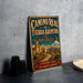 A vintage-style metal sign for the Camino Real de Tierra Adentro trail in New Mexico, featuring a desert landscape with a church and mountains in the background.