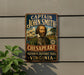 A vintage-style metal sign with the text "CAPTAIN JOHN SMITH" and "CHESAPEKE NATIONAL HISTORIC TRAIL VIRGINIA" is displayed on a wall, with a plant visible to the left.