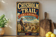 a vintage-style sign for the Chisholm Trail in Oklahoma, with a cowboy on horseback and a scenic landscape in the background.