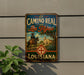 A vintage-style metal sign with a cowboy on a horse, advertising "El Camino Real de los Tejas Louisiana".