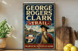 A vintage-style metal sign featuring the name "GEORGE ROGERS CLARK" and the title "TRAIL" along with an illustration of a man in military attire. The sign is displayed on a wooden shelf, with a potted plant and a wooden cutting board visible in the background.