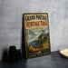 A vintage-style metal sign for the Grand Portage Heritage Trail in Minnesota, featuring an illustration of a canoe and a cabin, along with text promoting the trail and its history.