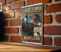 A vintage-style poster of Harriet Tubman, the famous Underground Railroad leader, is displayed on a brick wall.