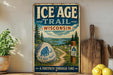 A vintage-style sign for the Ice Age Trail in Wisconsin, featuring a scenic landscape with a path leading through time.