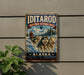 A vintage-style metal sign for the Iditarod National Historic Trail in Alaska, featuring a sled dog team in a snowy landscape.