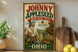 A vintage-style sign for Johnny Appleseed's Heritage Trail, featuring an illustration of a man holding an apple and walking through a scenic landscape with apple trees.