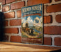 A vintage-style metal sign for the Mormon Pioneer National Historic Trail in Illinois, featuring an illustration of a covered wagon and a sign with the word "Illinois".