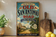 a vintage-style sign for the Old San Antonio Road in Louisiana, with a scenic illustration of a road leading to a church.