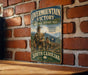 a vintage-style sign for the Overmountain Victory National Historic Trail in South Carolina, depicting a group of soldiers marching in a line.