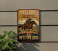 A vintage-style metal sign for Pony Express National Historic Trail, featuring a cowboy riding a horse and the text "The mail must go through WYOMING".