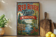A vintage-style sign for the Red River Trail in Minnesota, featuring a scenic river and forest landscape.