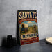 A vintage-style sign for the National Historic Trail in Missouri, featuring an illustration of a covered wagon and the text "Santa Fe NATIONAL HISTORIC TRAIL MISSOURI DISCOVER THE PATH OF HISTORY EXPLORE *LEARN *PRESERVE".
