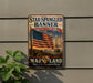 A vintage metal sign with the text "Star-Spangled Banner" and "National Historic Trail" is displayed on a gray wall, featuring an American flag and a ship.