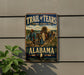 A vintage-style metal sign for the Trail of Tears, featuring a wagon train traveling through a scenic landscape in Alabama.