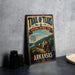 A vintage-style sign for the Trail of Tears National Historic Trail in Arkansas, featuring an illustration of people traveling down a path through a scenic landscape.