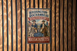 A vintage-style metal sign with the text "Washington-Rochambeau Revolutionary Route" and "A Path of History, Alliance & Liberty" is displayed on a wooden wall.