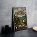 A vintage-style metal sign for Wilderness Road in Virginia, featuring a wagon on a trail and a scenic mountain landscape.