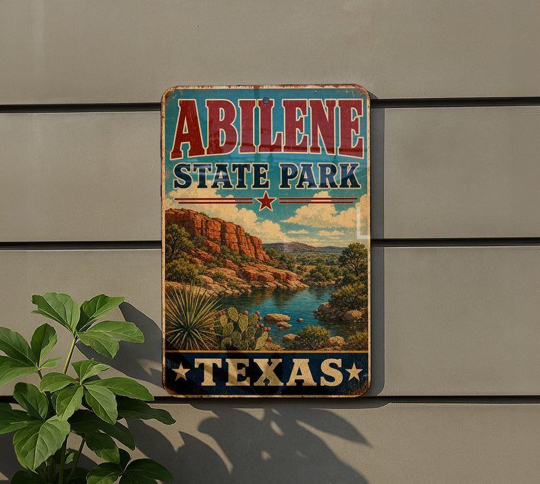 A vintage-style sign for Abilene State Park in Texas, featuring a scenic landscape with mountains, cacti, and a river.