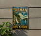 A vintage-style metal sign for All-American H. Treman State Marine Park, featuring a scenic image of a waterfall and sailboat in Finger Lakes, New York.