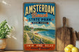 A vintage-style poster advertising Amsterdam Beach State Park in New York, featuring a scenic beach and ocean view.