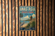 A vintage metal sign for Anastasia State Park in Florida, featuring a beach scene with palm trees and a crane, mounted on a wooden wall.