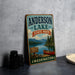 A vintage-style sign for Anderson Lake State Park in Washington, featuring a scenic image of a lake, mountains, and a red canoe.