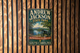 A vintage-style metal sign for Andrew Jackson State Park in South Carolina, featuring a cannon and a scenic landscape.