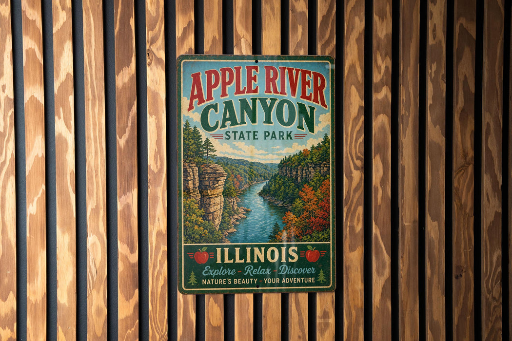 A vintage-style metal sign for Apple River Canyon State Park in Illinois, featuring a scenic illustration of the canyon and its surroundings.
