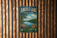 A vintage-style metal sign for Argyle Lake State Park in Illinois, featuring a scenic landscape with a lake, trees, and a wooden dock.