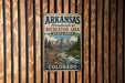 A vintage metal sign for Arkansas Headwaters Recreation Area State Park in Colorado, featuring a scenic mountain landscape.