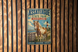A metal sign with a horse and lighthouse in the background, mounted on a wooden fence.