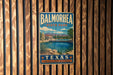 A vintage metal sign for Balmorhega State Park in Texas, featuring a scenic landscape with a pool and mountains in the background.