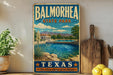 A vintage-style metal sign for Balmorhea State Park in Texas, featuring a scenic image of a swimming pool surrounded by desert landscape and mountains.