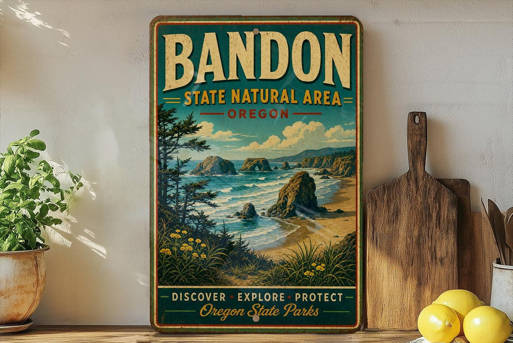 A vintage-style poster of Bandon State Natural Area in Oregon, featuring a scenic coastal landscape with rocky cliffs, a beach, and a pine tree.