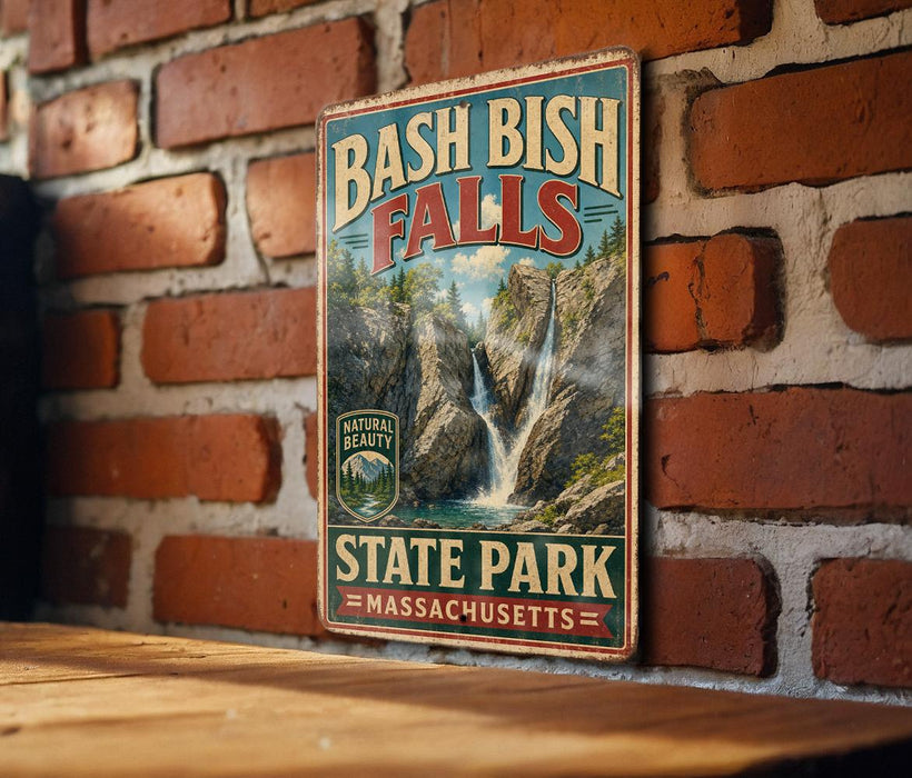 A vintage-style sign for Bash Bish Falls State Park in Massachusetts, featuring a scenic image of the waterfall and mountains.