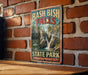 A vintage-style sign for Bash Bish Falls State Park in Massachusetts, featuring a scenic image of the waterfall and mountains.