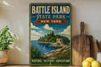 A vintage-style metal sign for Battle Island State Park in New York, featuring a scenic landscape with a lighthouse and a body of water.