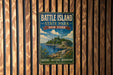 A vintage-style metal sign for Battle Island State Park in New York, featuring a scenic illustration of the island and its surrounding landscape.