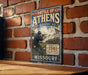 A vintage metal sign depicting a Civil War battle scene in Missouri, with a soldier aiming a rifle.