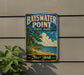 A vintage-style metal sign for Bayswater Point State Park in New York, featuring a scenic landscape with a beach, trees, and a body of water.
