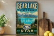 A vintage-style metal sign for Bear Lake State Park in Utah, featuring a scenic landscape with mountains, pine trees, and a lake.