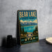 A vintage metal sign for Bear Lake State Park in Utah, featuring a scenic landscape with mountains, pine trees, and a lake.