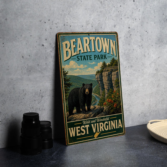 A vintage-style metal sign for Beartown State Park in West Virginia, featuring a black bear in a mountainous landscape.