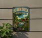 A vintage-style metal sign for Beaver Creek State Park in Ohio, featuring a scenic illustration of a waterfall and a red wooden bridge.