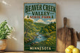 A vintage-style sign for Beaver Creek Valley State Park in Minnesota, featuring a scenic landscape with a river, trees, and mountains.