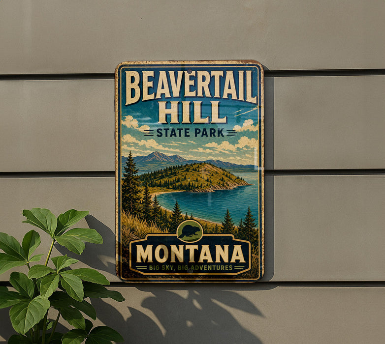 A vintage-style metal sign for Beavertail Hill State Park in Montana, featuring a scenic landscape with mountains, pine trees, and a lake.