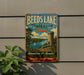 A vintage-style metal sign for Beeds Lake State Park in Iowa, featuring a scenic landscape with a castle, lake, and trees.